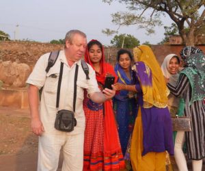 The Indian girls and the Russian tourists take a selfie on the mobile phone